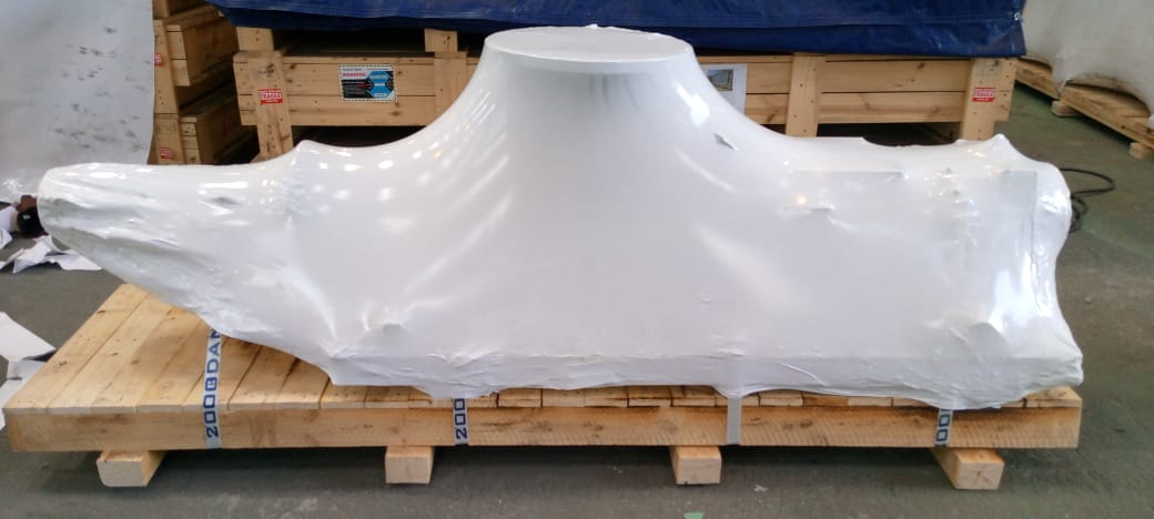 AfriPly industrial packaging with equipment shrink wrapped for secure transport.